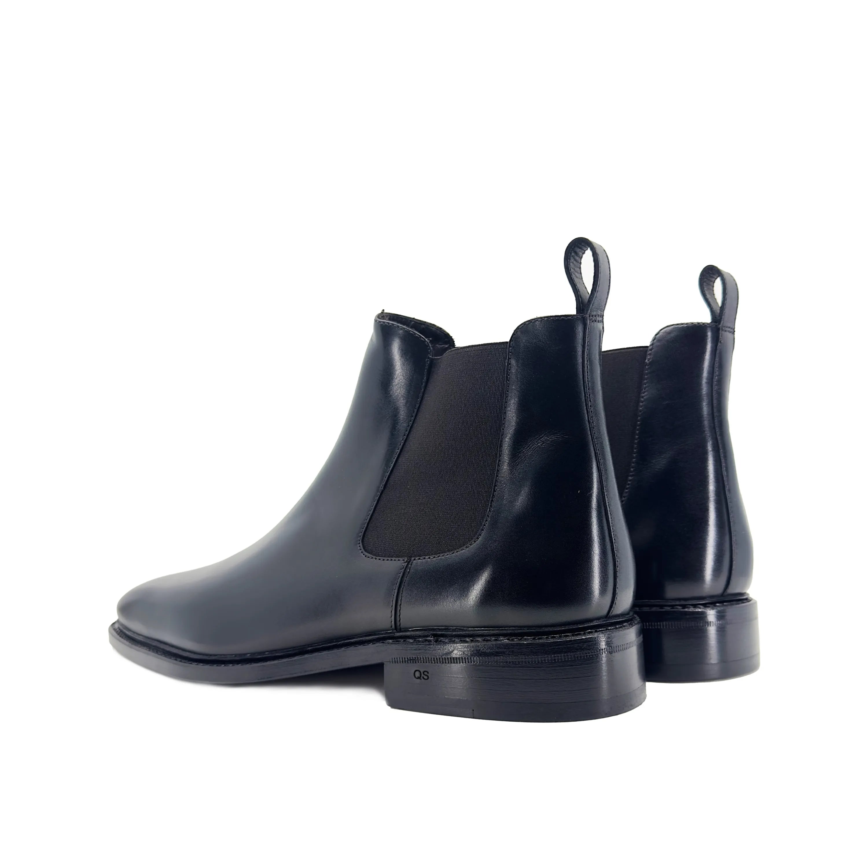 Pair of black leather Cave Chelsea Boots II