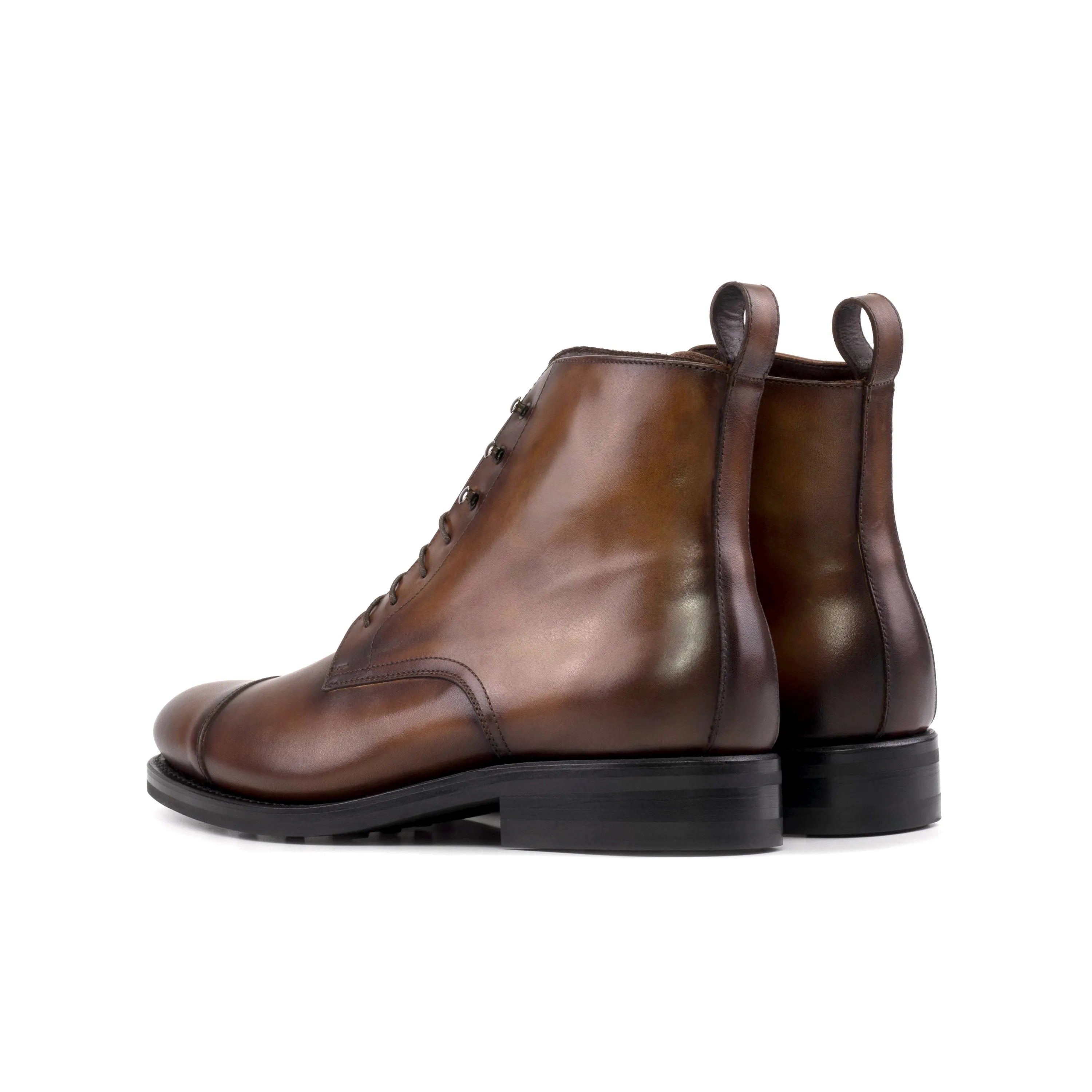 Back view of brown leather lace-up Raj Jumper Boots in fast lane style