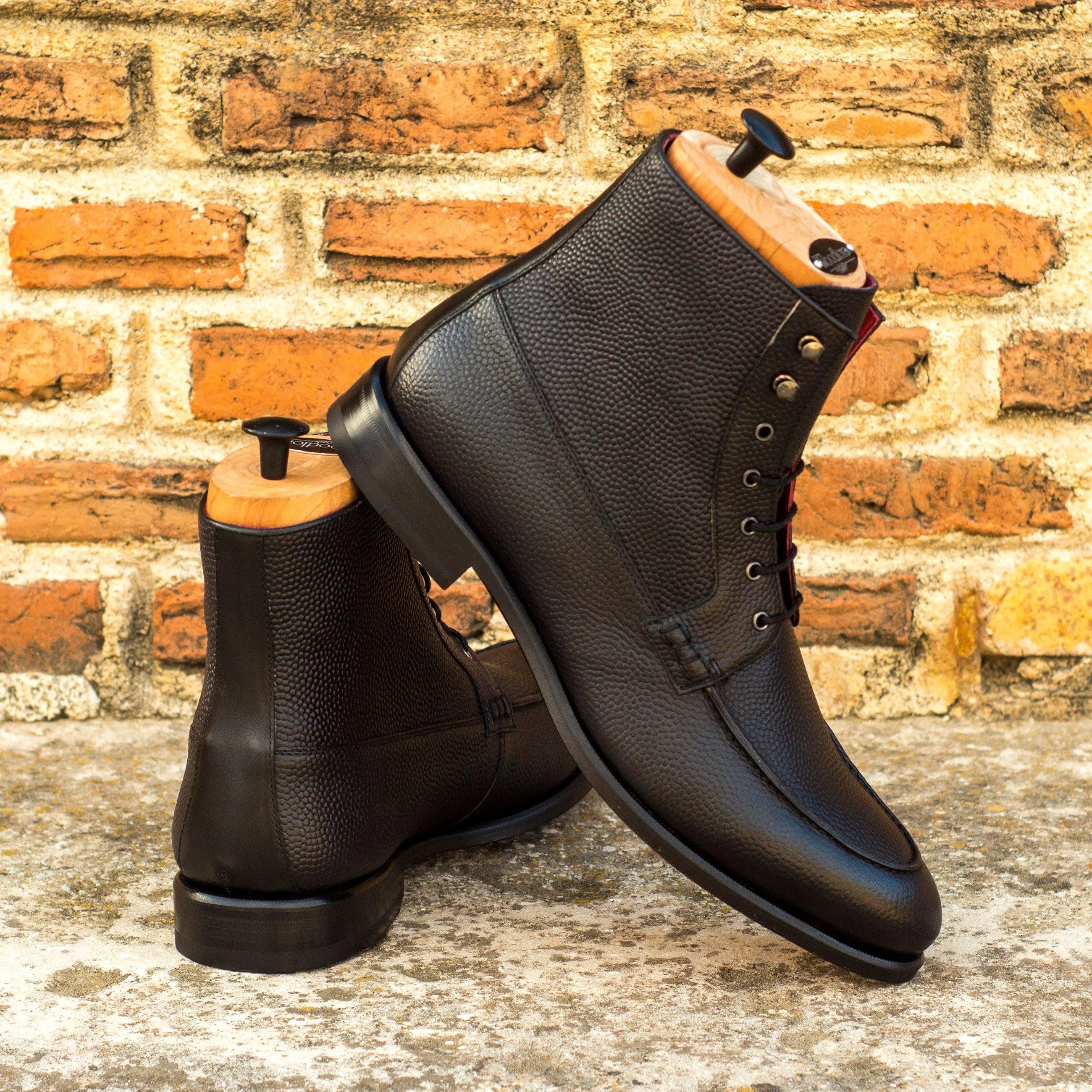 Denver moc boot pair of black leather boots with wooden shoe trees