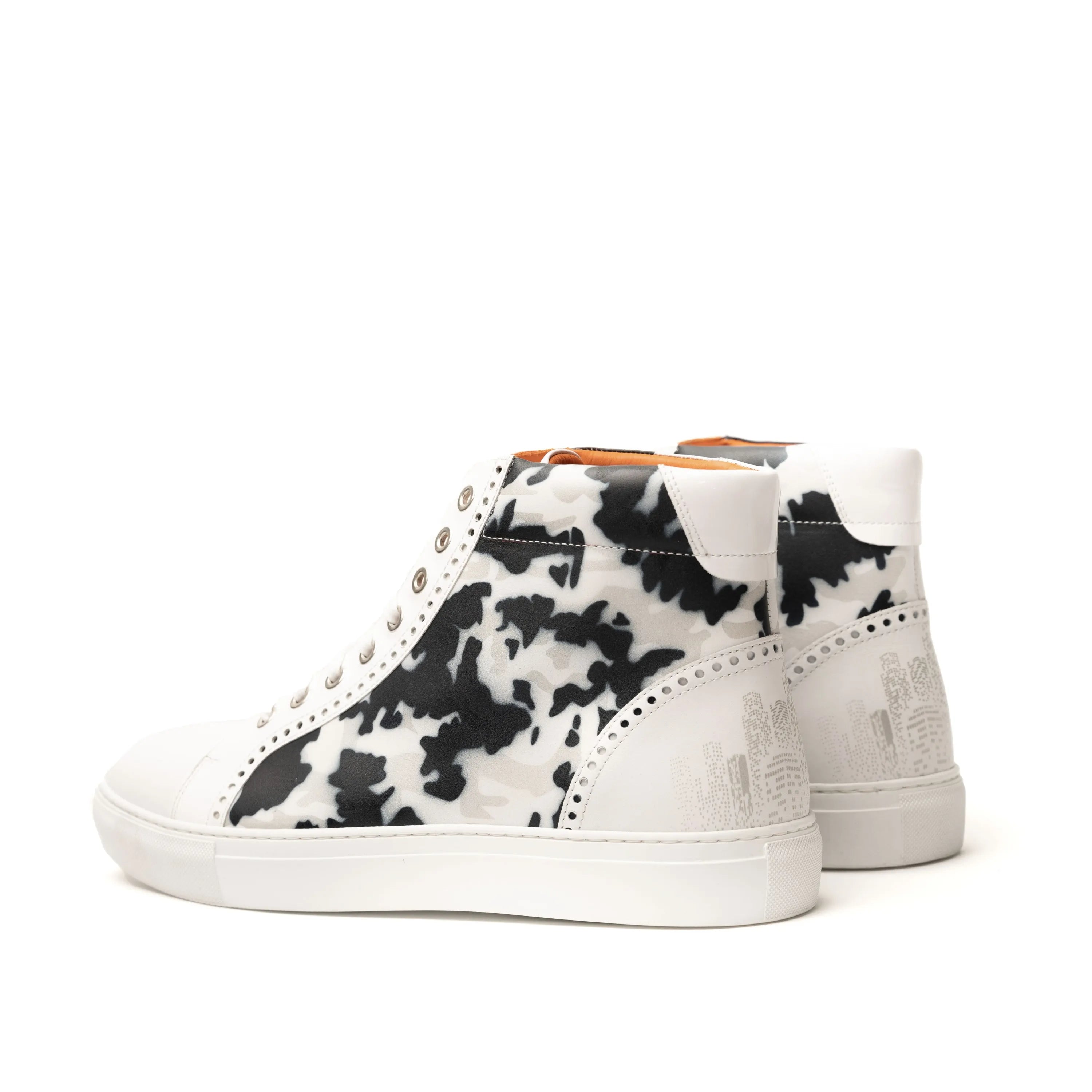 NYC High Kicks chunky trainer sneaker in white with black cow print